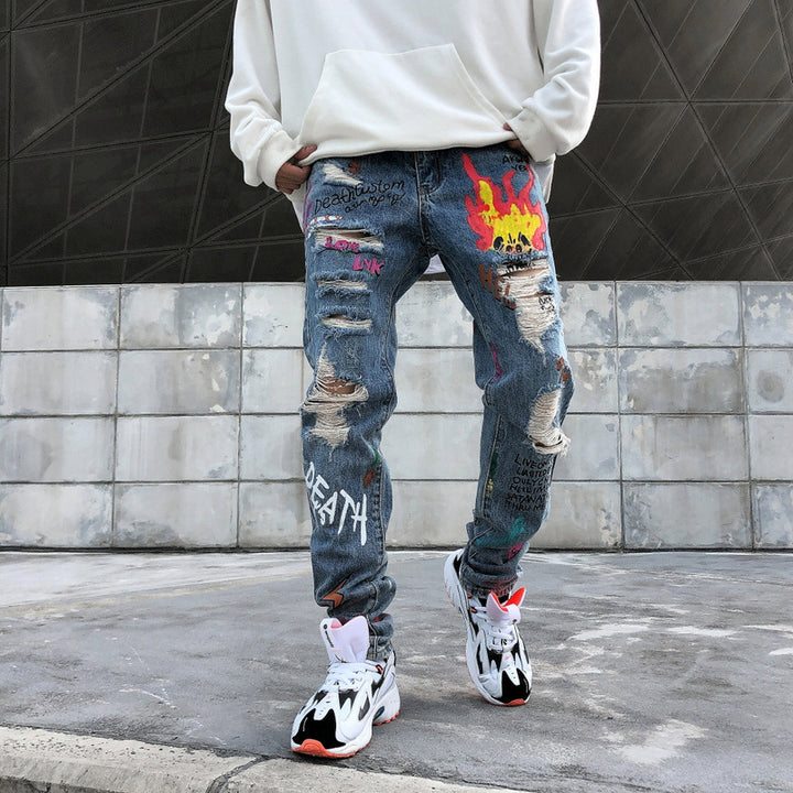 Graffiti print ripped jeans